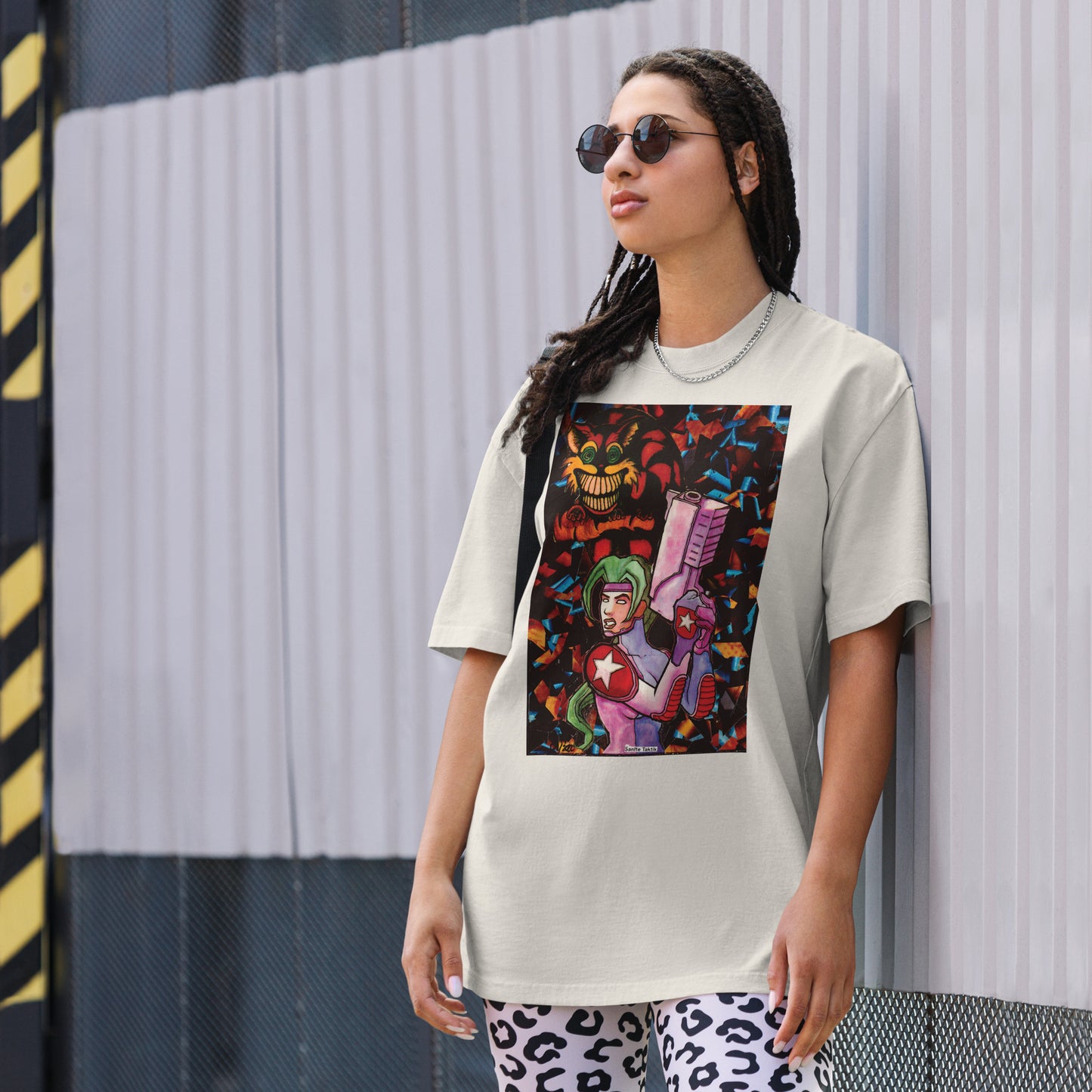Oversized T-shirt featuring a futuristic warrior design with bold colors, blending chaos and control.